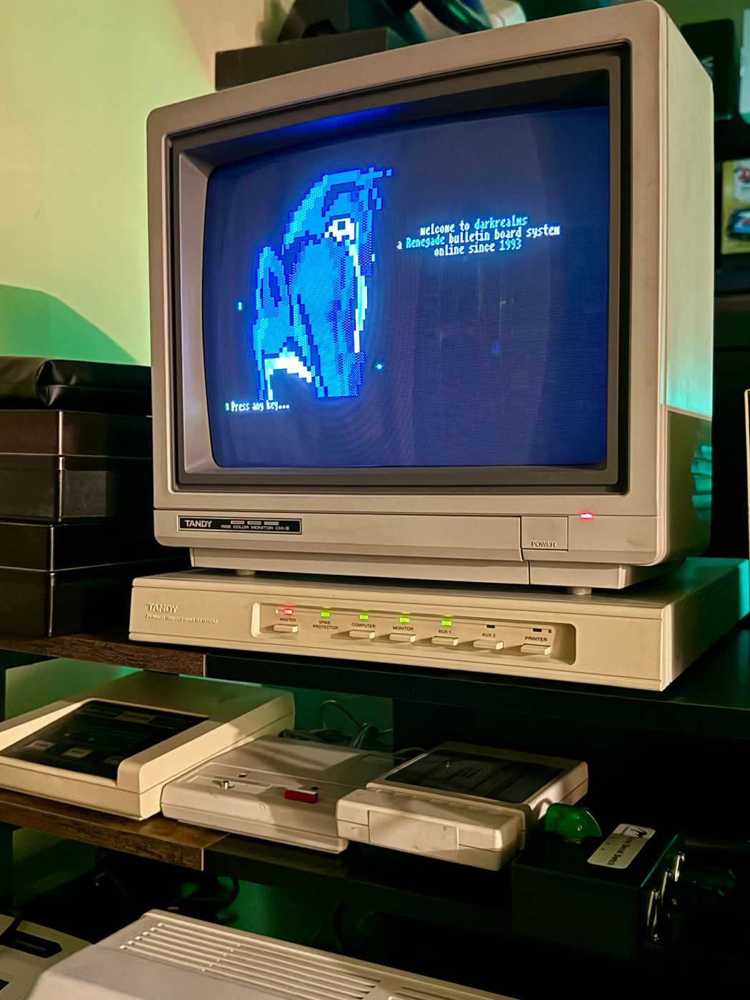 Color Computer 3 monitor showing GiME ANSi connected to a live Darkrealms BBS session